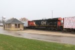 Running as a midtrain DPU, 3170 rolls past the depot as X342 continues past